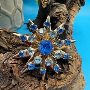 Vintage blue glass stone gold tone starburst, EUC